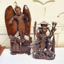An Eastern carving of a winged goddess, 42 cm high, and a carving of a fisherman, 30 cm high (2)