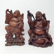 A Chinese carving of a buddha, 25 cm high, and another similar (2)