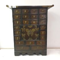 A Chinese miniature apothecary cabinet, 52 cm wide