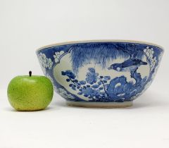 A Chinese blue and white bowl, decorated birds, 30 cm diameter Impact crack to base, various
