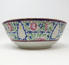 A Chinese bowl, decorated flowers in enamel colours, 29 cm diameter