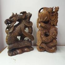 A Chinese carving of a dragon, 48 cm high, and another, 32 cm high (2)