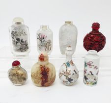 A Chinese snuff bottle, decorated birds, 8 cm high, and seven others (8)