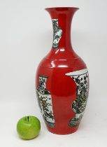 A Chinese red ground vase, decorated vases, six character mark to base, 43 cm high
