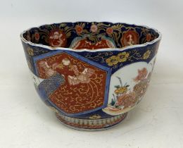 A Japanese Imari bowl, the centre decorated a dragon, 22 cm diameter Water marked, decoration worn