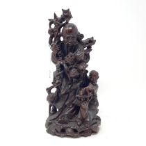 A Chinese bamboo root carving, of a figure and child, 30 cm high