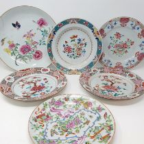 A Chinese famille verte plate, decorated flowers and butterflies, 27 cm diameter, and five others (