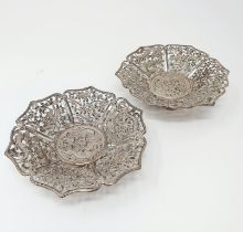 A pair of Chinese silver coloured metal pierced dishes, decorated dragons (2) 142 g