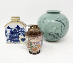 A Chinese cup, converted to a lighter, a blue and white caddy, and a green glazed vase (3)