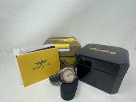 A gentleman's Breitling, 1884 Wings wristwatch, on a blue leather strap, boxed with paperwork