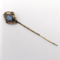 A late 19th/early 20th century yellow metal and cameo glass stick pin Provenance: From a single
