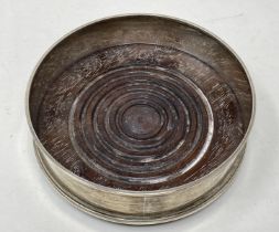 A modern silver and mahogany bottle coaster, 13 cm diameter