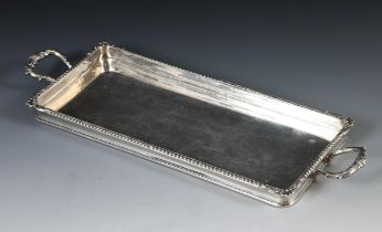 A silver two handled rectangular tray, retailed by Harrods, Sheffield 1926, 25.3 ozt, 40.5 cm wide