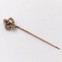A late 19th/early 20th century yellow metal, garnet and seed pearl stick pin Provenance: From a