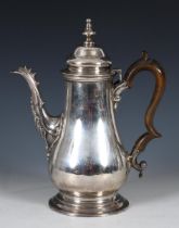 A George II silver coffee pot, with a wooden handle, London 1756, all in 27.1 ozt