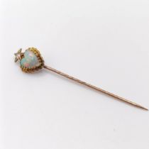 A late 19th/early 20th century yellow metal, opal and diamond stick pin, in the form of a heart