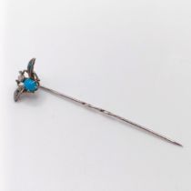 A silver coloured metal, turquoise and seed pearl stick pin, in the form of a fly Provenance: From a