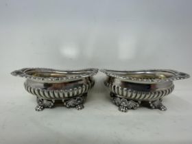 A pair of George III silver oval salts, with lion paw feet, London 1819, 9.9 ozt