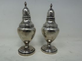 A pair of Continental silver coloured metal pepperpots, 3.9 ozt