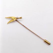 A 20th century yellow metal and diamond stick pin, in the form of two feathers Provenance: From a
