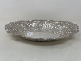 An embossed silver oval bowl, 5.4 ozt