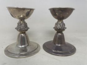 A pair of silver squat candlesticks, the stems decorated fox heads, 7.7 ozt (2)