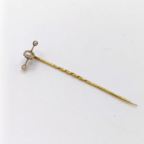 An early 20th century yellow metal and pearl stick pin Provenance: From a single owner collection of
