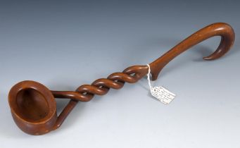 A late 18th/early 19th Century carved treen punch ladle, from a single piece of wood, the bowl inset