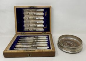 A modern silver coaster, and a set of silver plated fish knives and forks, with mother of pearl