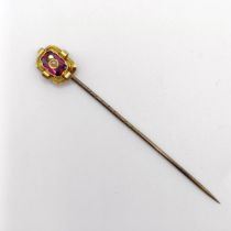 A late 19th/early 20th century yellow metal, amethyst and seed pearl stick pin Provenance: From a