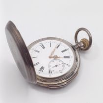 A silver coloured metal hunter pocket watch, with repeat, engraved an armorial Stamped .800, dial