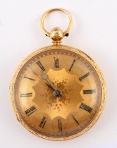 An 18ct gold fob watch, with engraved decoration 52.3 g (all in) with an associated key watch