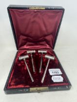 A set of four Victorian silver and silver gilt pepperettes, in the form of gavels/hammers, London
