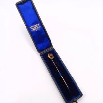 A 19th century cabochon cut garnet stick pin, in a vintage jewellery box Provenance: From a single