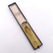 A late 19th/early 20th century red and white stone stick pin, in a vintage jewellery box Provenance: