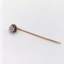 A late 19th/early 20th century silver coloured metal, yellow metal and diamond stick pin Provenance: