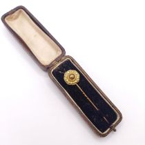 A late 19th/early 20th century yellow metal stick pin, in a vintage jewellery box Provenance: From a