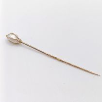 A yellow metal and cultured pearl stick pin Provenance: From a single owner collection of Victorian,