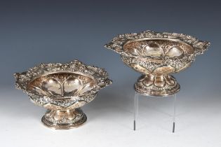 A pair of late Victorian silver bowls, with embossed decoration, Sheffield 1901, 13.3 ozt (2)