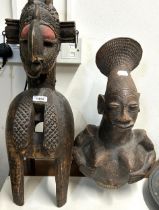 An African figural pottery jug, 50 cm high, and an African carving, 61 cm high (2)