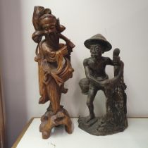 A Chinese carving of a figure, converted to a lamp base, 55 cm high, and an Eastern carving of a