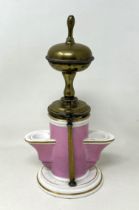 An unusual 19th century porcelain and brass inkwell, in the form of a drinking fountain,