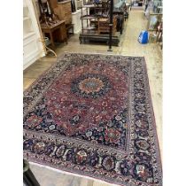 A Persian style red ground carpet, 336 x 240 cm