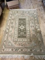 A Persian style cream ground rug, 170 x 116 cm