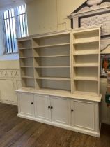 A painted bookcase cabinet, 220 cm high x 220 cm wide