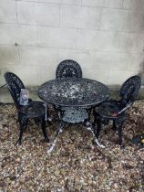 A painted metal garden table, and three chairs (4)