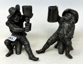 A pair of pewter candleholder figures, of men drinking, 14 cm high (2) Overall condition good, light