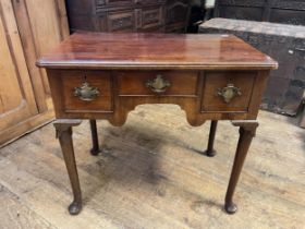 A 19th century mahogany lowboy, with three drawers, on tapering legs and pad feet, 76 cm wide