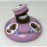 A 19th century Continental inkwell, with a pink ground, decorated portraits, 13 cm wide