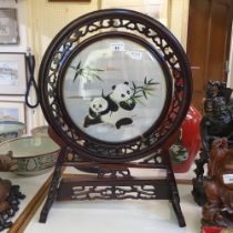 A Chinese table screen, inset with silk panel, decorated pandas, 58 cm high